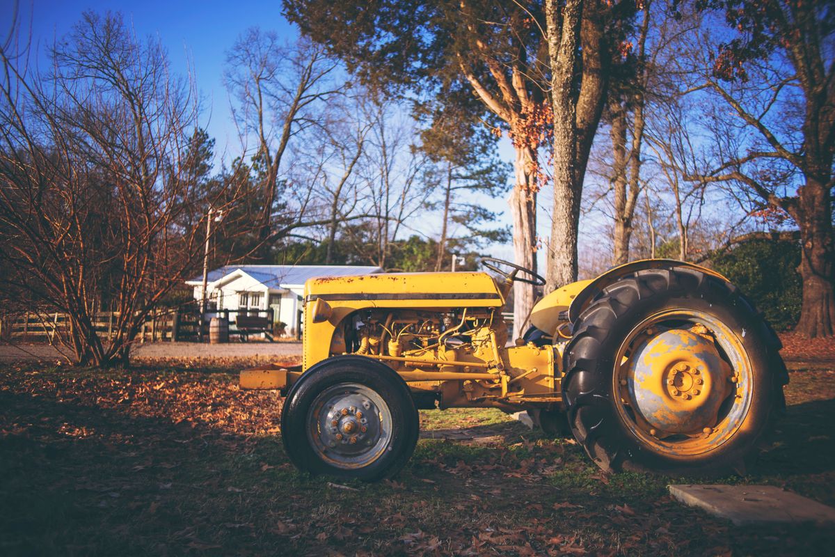 A tractor and farm equipment for auction